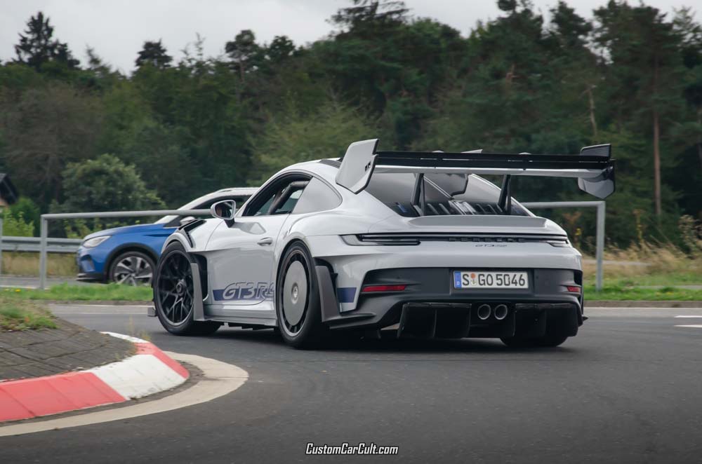 Rear side of the Porsche 992 GT3 RS with Manthey Racing Kit, including huge rear wing, a shark fin on the rear window and aerodisks on the rear wheels